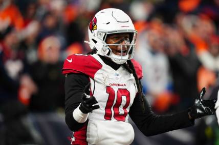 Dec 18, 2022; Denver, Colorado, USA; Arizona Cardinals wide receiver DeAndre Hopkins (10) reacts in the second half against the Denver Broncos at Empower Field at Mile High. Mandatory Credit: Ron Chenoy-USA TODAY Sports