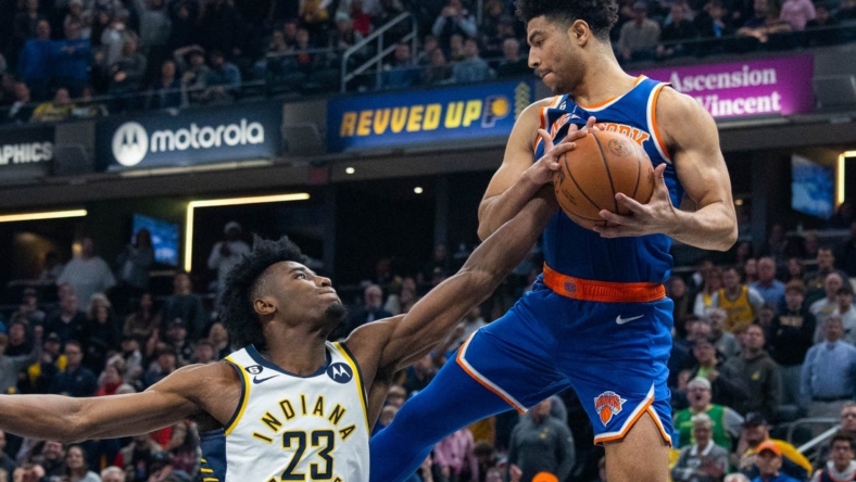 Dec 18, 2022; Indianapolis, Indiana, USA; Indiana Pacers forward Aaron Nesmith (23) and New York Knicks guard Quentin Grimes (6) go for a rebound in the second half at Gainbridge Fieldhouse. Mandatory Credit: Trevor Ruszkowski-USA TODAY Sports