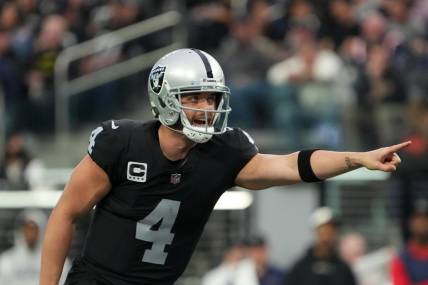 Dec 18, 2022; Paradise, Nevada, USA; Las Vegas Raiders quarterback Derek Carr (4) gestures against the New England Patriots in the first half at Allegiant Stadium. The Raiders defeated the Patriots 30-24. Mandatory Credit: Kirby Lee-USA TODAY Sports