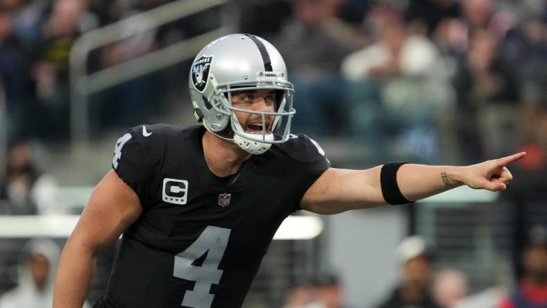 Dec 18, 2022; Paradise, Nevada, USA; Las Vegas Raiders quarterback Derek Carr (4) gestures against the New England Patriots in the first half at Allegiant Stadium. The Raiders defeated the Patriots 30-24. Mandatory Credit: Kirby Lee-USA TODAY Sports