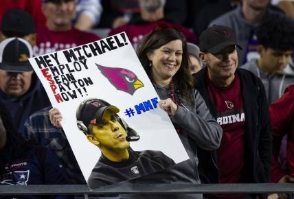 Dec 12, 2022; Glendale, Arizona, USA; An Arizona Cardinals fan in the crowd holds a sign for Sean Payton during the game against the New England Patriots at State Farm Stadium. Mandatory Credit: Mark J. Rebilas-USA TODAY Sports
