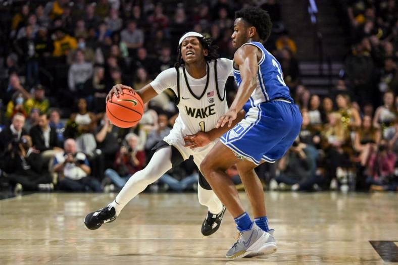 Dec 20, 2022; Winston-Salem, North Carolina, USA; Wake Forest Demon Deacons guard Tyree Appleby (1) is checked by Duke Blue Devils guard Jeremy Roach (3) during the second half at Lawrence Joel Veterans Memorial Coliseum. Mandatory Credit: William Howard-USA TODAY Sports
