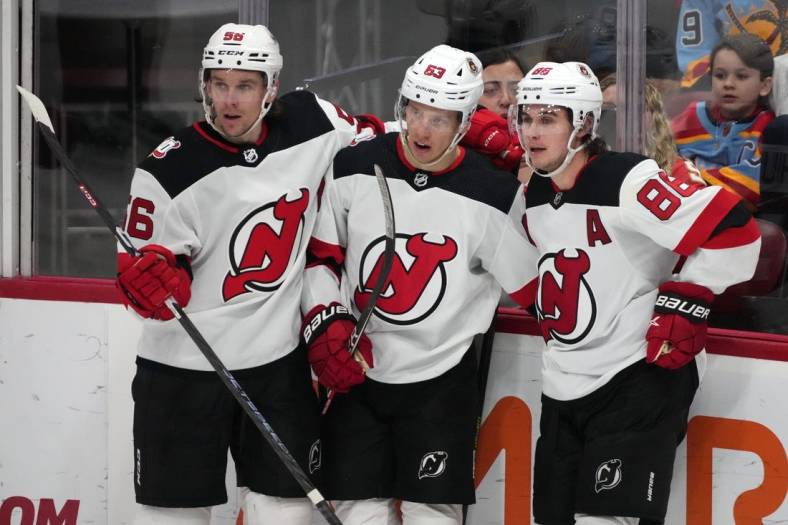 Dec 21, 2022; Sunrise, Florida, USA; New Jersey Devils left wing Jesper Bratt (63) celebrates his goal against the Florida Panthers with teammates on the ice during the third period at FLA Live Arena. Mandatory Credit: Jasen Vinlove-USA TODAY Sports