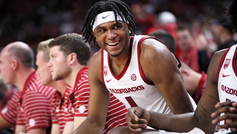 Dec 21, 2022; Fayetteville, Arkansas, USA; Arkansas Razorbacks guard Ricky Council IV celebrates from the bench during the second half against the UNC Asheville Bulldogs at Bud Walton Arena. Arkansas won 85-51. Mandatory Credit: Nelson Chenault-USA TODAY Sports