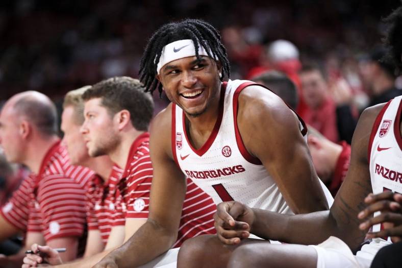 Dec 21, 2022; Fayetteville, Arkansas, USA; Arkansas Razorbacks guard Ricky Council IV celebrates from the bench during the second half against the UNC Asheville Bulldogs at Bud Walton Arena. Arkansas won 85-51. Mandatory Credit: Nelson Chenault-USA TODAY Sports
