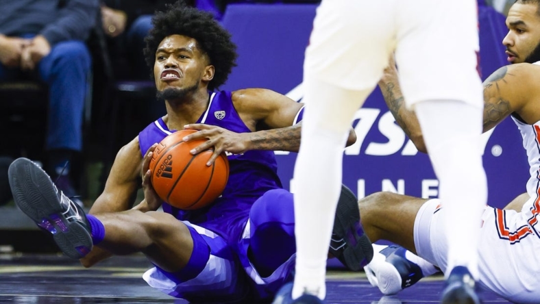 Dec 21, 2022; Seattle, Washington, USA; Washington Huskies forward Keion Brooks (1) attempts to pass after collecting a loose ball against Auburn Tigers forward Johni Broome (4) during the second half at Alaska Airlines Arena at Hec Edmundson Pavilion. Mandatory Credit: Joe Nicholson-USA TODAY Sports