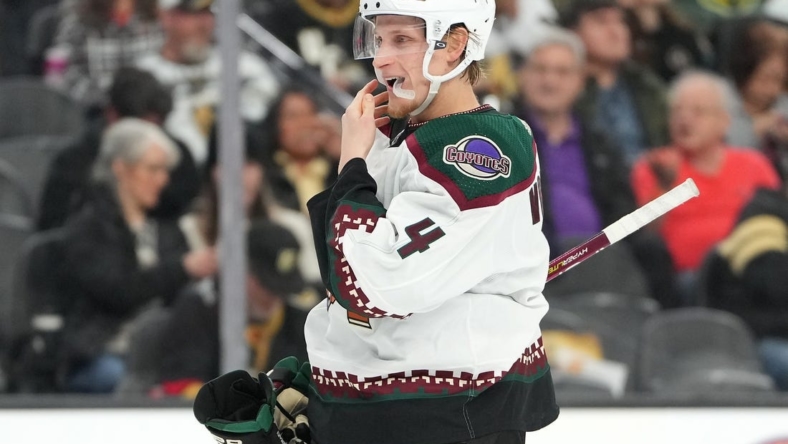 Dec 21, 2022; Las Vegas, Nevada, USA; Arizona Coyotes defenseman Juuso Valimaki (4) prepares for a face off against the Vegas Golden Knights during the second period at T-Mobile Arena. Mandatory Credit: Stephen R. Sylvanie-USA TODAY Sports