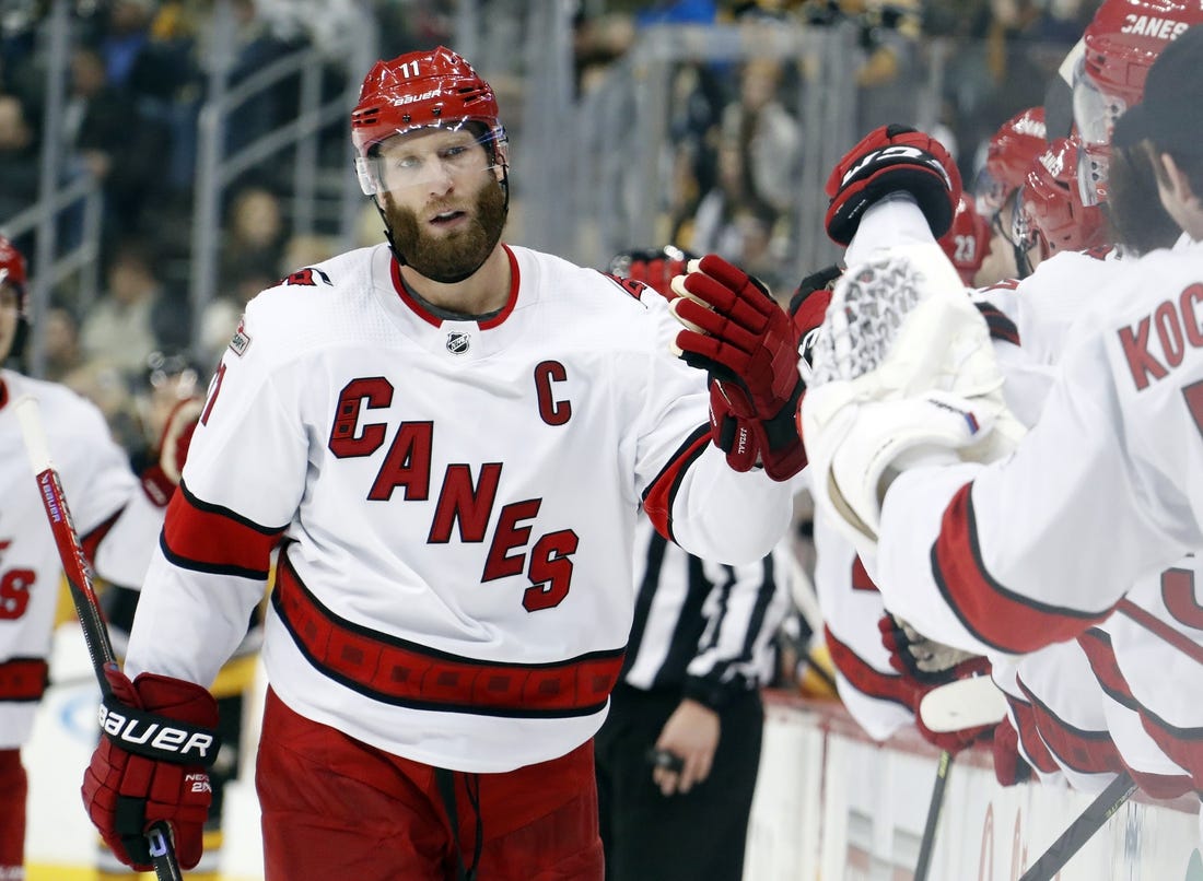 Dec 22, 2022; Pittsburgh, Pennsylvania, USA; Carolina Hurricanes center Jordan Staal (11) celebrates with the Carolina bench after scoring a goal against the Pittsburgh Penguins during the third period at PPG Paints Arena. Carolina won 4-3 in overtime. Mandatory Credit: Charles LeClaire-USA TODAY Sports