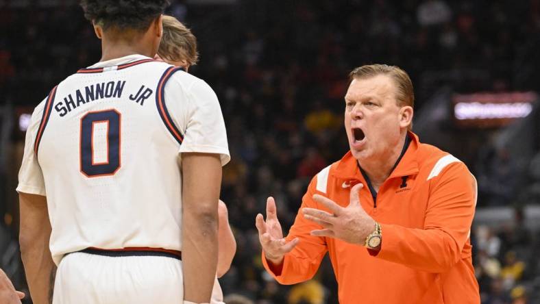 Dec 22, 2022; St. Louis, Missouri, USA;  Illinois Fighting Illini head coach Brad Underwood reacts as he talks to guard Terrence Shannon Jr. (0) during the second half against the Missouri Tigers at Enterprise Center. Mandatory Credit: Jeff Curry-USA TODAY Sports