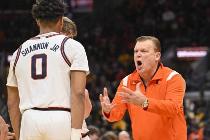 Dec 22, 2022; St. Louis, Missouri, USA;  Illinois Fighting Illini head coach Brad Underwood reacts as he talks to guard Terrence Shannon Jr. (0) during the second half against the Missouri Tigers at Enterprise Center. Mandatory Credit: Jeff Curry-USA TODAY Sports