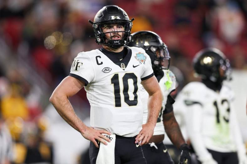 Dec 23, 2022; Tampa, Florida, USA; Wake Forest Demon Deacons quarterback Sam Hartman (10) waits for a play call against the Missouri Tigers during  the second quarter in the 2022 Gasparilla Bowl at Raymond James Stadium. Mandatory Credit: Nathan Ray Seebeck-USA TODAY Sports