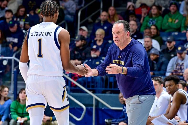 Dec 27, 2022; South Bend, Indiana, USA; Notre Dame Fighting Irish head coach Mike Brey talks to guard JJ Starling (1) in the first half against the Jacksonville Dolphins at the Purcell Pavilion. Mandatory Credit: Matt Cashore-USA TODAY Sports