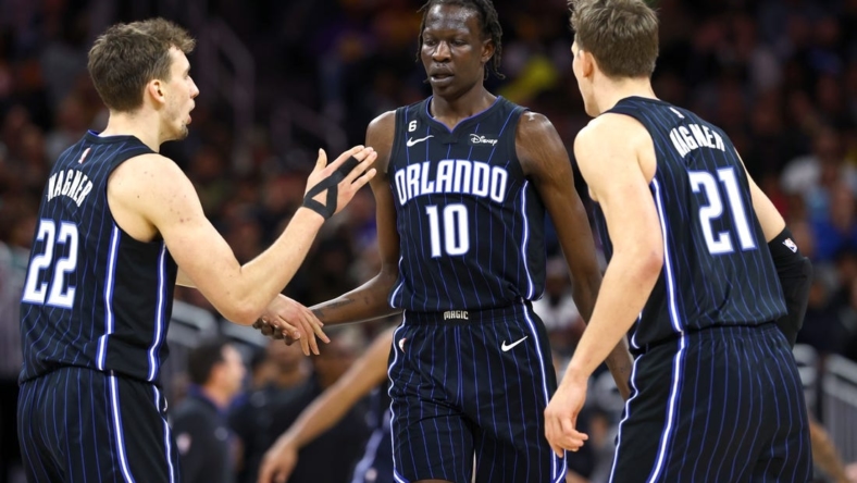 Dec 27, 2022; Orlando, Florida, USA; Orlando Magic forward Bol Bol (10) is congratulated by forward Franz Wagner (22) and center Moritz Wagner (21) against the Los Angeles Lakers during the second half at Amway Center. Mandatory Credit: Kim Klement-USA TODAY Sports