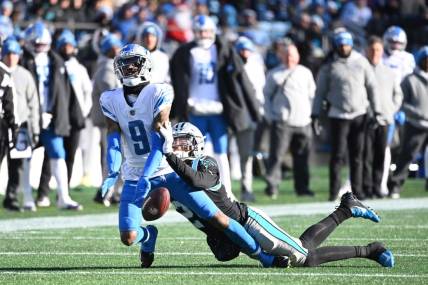 Dec 24, 2022; Charlotte, North Carolina, USA; Detroit Lions wide receiver Jameson Williams (9) cannot catch the pass as Carolina Panthers cornerback CJ Henderson (24) defends in the third quarter at Bank of America Stadium. Mandatory Credit: Bob Donnan-USA TODAY Sports