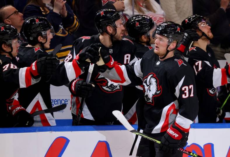 Dec 29, 2022; Buffalo, New York, USA;  Buffalo Sabres center Casey Mittelstadt (37) celebrates his goal with teammates during the first period against the Detroit Red Wings at KeyBank Center. Mandatory Credit: Timothy T. Ludwig-USA TODAY Sports