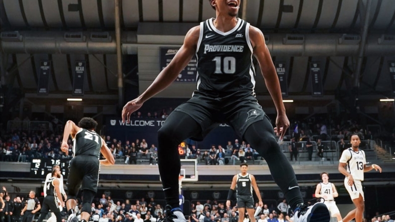 Dec 29, 2022; Indianapolis, Indiana, USA;  Providence Friars guard Noah Locke (10) celebrates after a dunk by Providence Friars guard Devin Carter (22) against the Butler Bulldogs during the first half at Hinkle Fieldhouse. Mandatory Credit: Robert Goddin-USA TODAY Sports