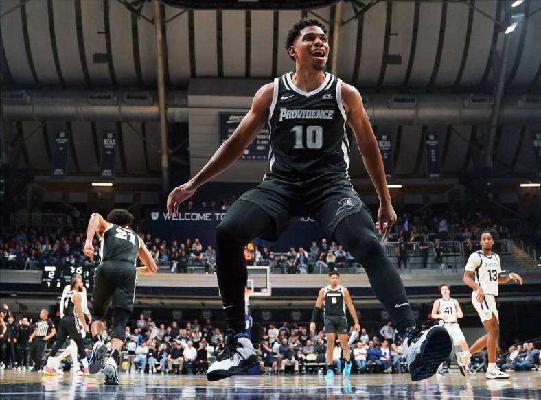 Dec 29, 2022; Indianapolis, Indiana, USA;  Providence Friars guard Noah Locke (10) celebrates after a dunk by Providence Friars guard Devin Carter (22) against the Butler Bulldogs during the first half at Hinkle Fieldhouse. Mandatory Credit: Robert Goddin-USA TODAY Sports