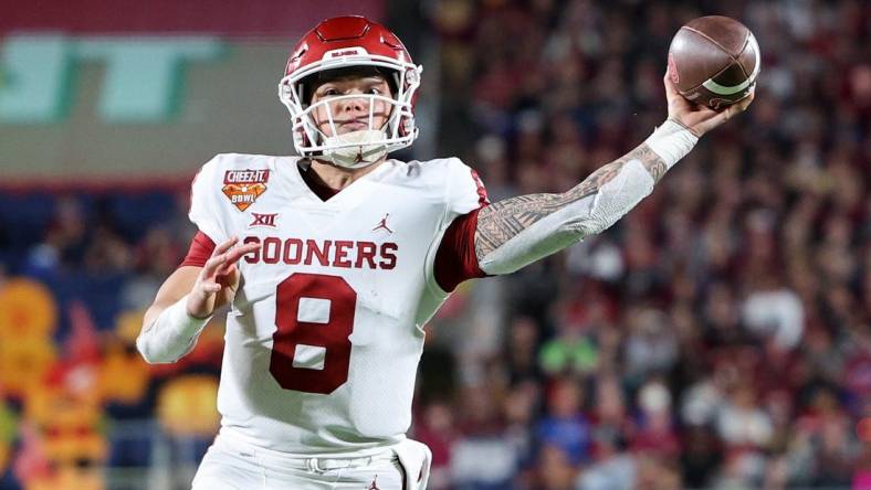 Dec 29, 2022; Orlando, Florida, USA; Oklahoma Sooners quarterback Dillon Gabriel (8) throws a pass against the Florida State Seminoles in the fourth quarter during the 2022 Cheez-It Bowl at Camping World Stadium. Mandatory Credit: Nathan Ray Seebeck-USA TODAY Sports