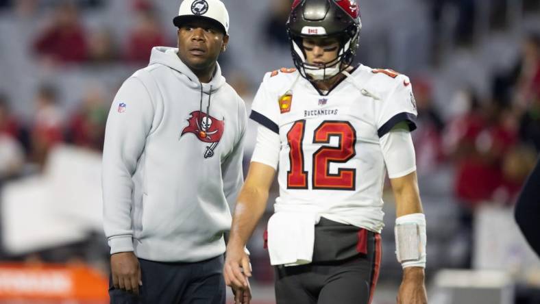 Dec 25, 2022; Glendale, Arizona, USA; Tampa Bay Buccaneers quarterback Tom Brady (12) with offensive coordinator Byron Leftwich against the Arizona Cardinals at State Farm Stadium. Mandatory Credit: Mark J. Rebilas-USA TODAY Sports