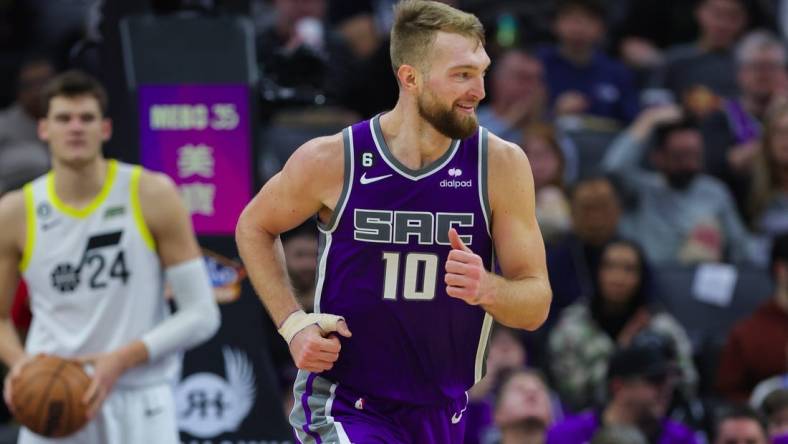 Dec 28, 2022; Sacramento, California, USA; Sacramento Kings forward Domantas Sabonis (10) runs up the court during the third quarter against the Utah Jazz at Golden 1 Center. Mandatory Credit: Sergio Estrada-USA TODAY Sports