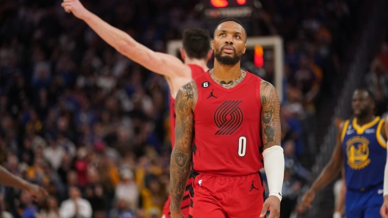 Dec 30, 2022; San Francisco, California, USA; Portland Trail Blazers guard Damian Lillard (0) reacts after committing a turnover against the Golden State Warriors in the fourth quarter at the Chase Center. Mandatory Credit: Cary Edmondson-USA TODAY Sports