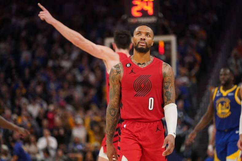Dec 30, 2022; San Francisco, California, USA; Portland Trail Blazers guard Damian Lillard (0) reacts after committing a turnover against the Golden State Warriors in the fourth quarter at the Chase Center. Mandatory Credit: Cary Edmondson-USA TODAY Sports