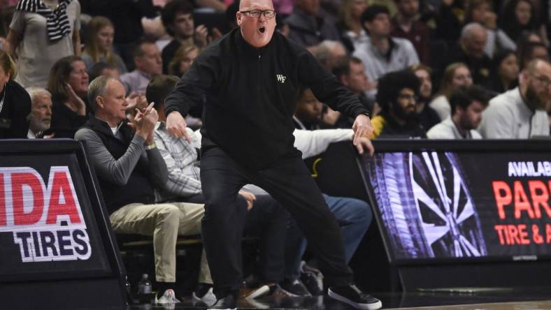 Dec 31, 2022; Winston-Salem, North Carolina, USA; Wake Forest Demon Deacons head coach Steve Forbes cheers on the team against the Virginia Tech Hokies during the second half at Lawrence Joel Veterans Memorial Coliseum. Mandatory Credit: William Howard-USA TODAY Sports