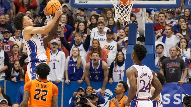 Dec 31, 2022; Lawrence, Kansas, USA; Kansas Jayhawks forward Jalen Wilson (10) rebounds against the Oklahoma State Cowboys during the second half at Allen Fieldhouse. Mandatory Credit: Denny Medley-USA TODAY Sports