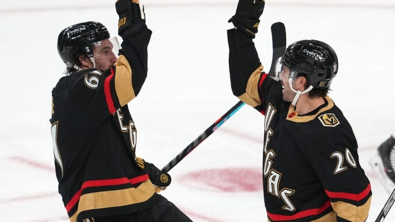 Dec 31, 2022; Las Vegas, Nevada, USA; Vegas Golden Knights center Chandler Stephenson (20) celebrates with Vegas Golden Knights right wing Mark Stone (61) after scoring a goal against the Nashville Predators during the third period at T-Mobile Arena. Mandatory Credit: Stephen R. Sylvanie-USA TODAY Sports