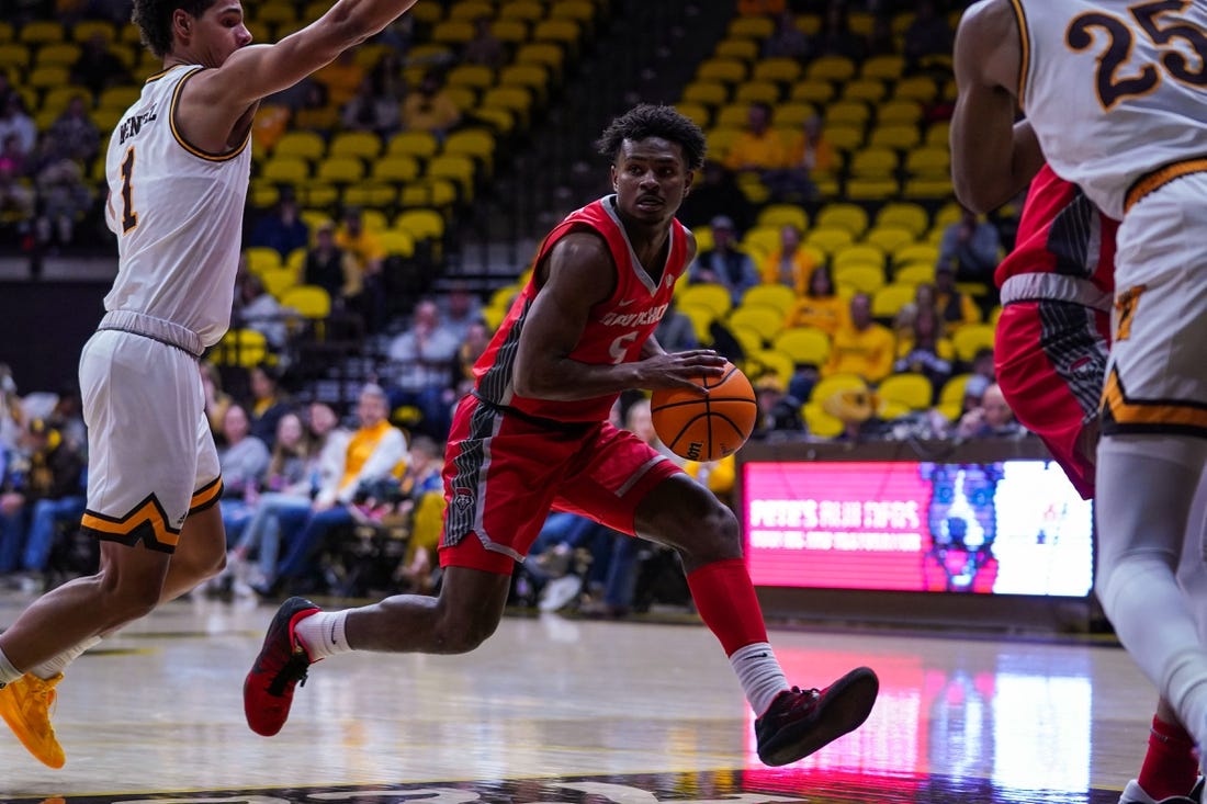 Dec 31, 2022; Laramie, Wyoming, USA; New Mexico Lobos guard Jamal Mashburn Jr. (5) drives against the Wyoming Cowboys during the first half at Arena-Auditorium. Mandatory Credit: Troy Babbitt-USA TODAY Sports