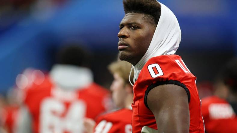 Dec 31, 2022; Atlanta, Georgia, USA; Georgia Bulldogs tight end Darnell Washington (0) looks on from the sideline after exiting the game with an injury against the Ohio State Buckeyes during the third quarter of the 2022 Peach Bowl at Mercedes-Benz Stadium. Mandatory Credit: Brett Davis-USA TODAY Sports