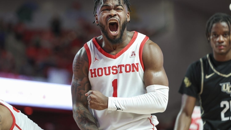 Dec 31, 2022; Houston, Texas, USA; Houston Cougars guard Jamal Shead (1) reacts after a play during the second half against the Central Florida Knights at Fertitta Center. Mandatory Credit: Troy Taormina-USA TODAY Sports