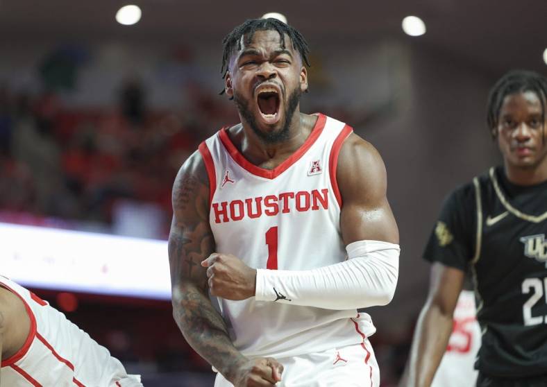 Dec 31, 2022; Houston, Texas, USA; Houston Cougars guard Jamal Shead (1) reacts after a play during the second half against the Central Florida Knights at Fertitta Center. Mandatory Credit: Troy Taormina-USA TODAY Sports