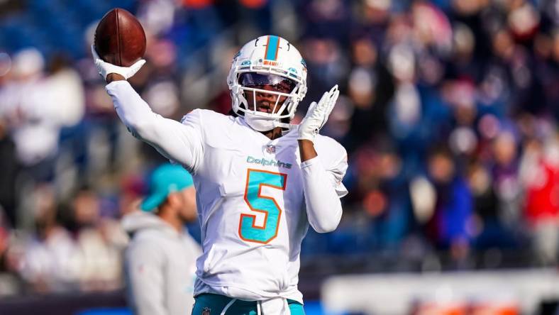 Jan 1, 2023; Foxborough, Massachusetts, USA; Miami Dolphins quarterback Teddy Bridgewater (5) warms up before the start of the game against the New England Patriots at Gillette Stadium. Mandatory Credit: David Butler II-USA TODAY Sports