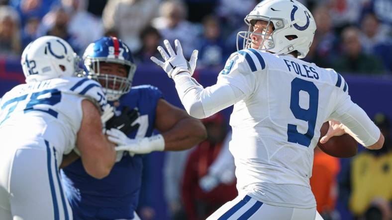 Jan 1, 2023; East Rutherford, New Jersey, USA;  Indianapolis Colts quarterback Nick Foles (9) throws the ball during the first quarter against the New York Giants at MetLife Stadium. Mandatory Credit: Vincent Carchietta-USA TODAY Sports