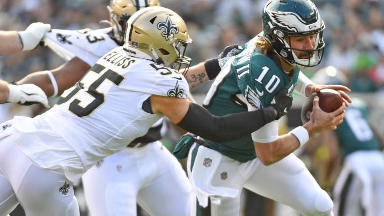 Jan 1, 2023; Philadelphia, Pennsylvania, USA; Philadelphia Eagles quarterback Gardner Minshew (10) is sacked by New Orleans Saints linebacker Kaden Elliss (55) during the first quarter at Lincoln Financial Field. Mandatory Credit: Eric Hartline-USA TODAY Sports