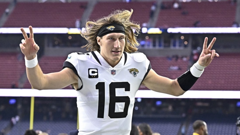 Jan 1, 2023; Houston, Texas, USA;  Jacksonville Jaguars quarterback Trevor Lawrence (16) reacts as he leaves the field after the win against the Houston Texans at NRG Stadium. Mandatory Credit: Maria Lysaker-USA TODAY Sports