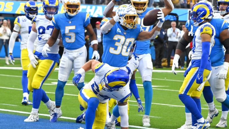 Jan 1, 2023; Inglewood, California, USA;  Los Angeles Chargers running back Austin Ekeler (30) celebrates after scoring a touchdown in the first half against the Los Angeles Rams at SoFi Stadium. Mandatory Credit: Jayne Kamin-Oncea-USA TODAY Sports