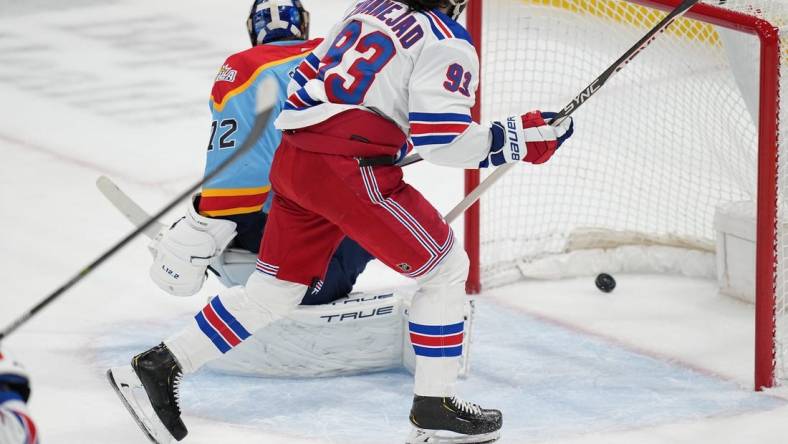 Jan 1, 2023; Sunrise, Florida, USA;  New York Rangers center Mika Zibanejad (93) scores a goal past Florida Panthers goaltender Sergei Bobrovsky (72) during the first period at FLA Live Arena. Mandatory Credit: Jim Rassol-USA TODAY Sports