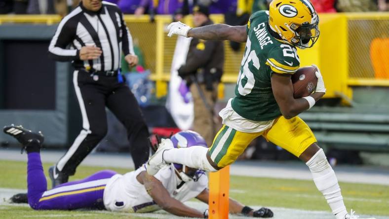 Jan 1, 2023; Green Bay, Wisconsin, USA; Green Bay Packers safety Darnell Savage (26) scores a touchdown on an interception return against the Minnesota Vikings at Lambeau Field. Mandatory Credit: Tork Mason-USA TODAY Sports