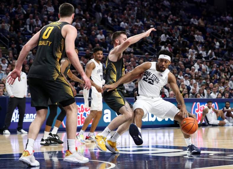 Jan 1, 2023; University Park, Pennsylvania, USA; Penn State Nittany Lions guard Jalen Pickett (22) dribbles the ball towards the basket during the first half against the Iowa Hawkeyes at Bryce Jordan Center. Mandatory Credit: Matthew OHaren-USA TODAY Sports