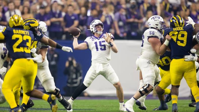 Dec 31, 2022; Glendale, Arizona, USA; TCU Horned Frogs quarterback Max Duggan (15) against the Michigan Wolverines during the 2022 Fiesta Bowl at State Farm Stadium. Mandatory Credit: Mark J. Rebilas-USA TODAY Sports