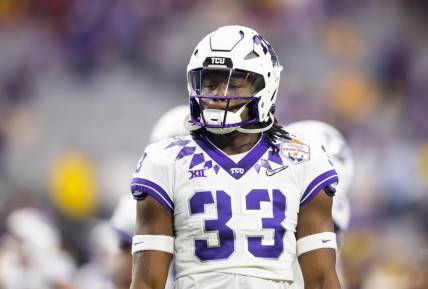 Dec 31, 2022; Glendale, Arizona, USA; TCU Horned Frogs running back Kendre Miller (33) against the Michigan Wolverines during the 2022 Fiesta Bowl at State Farm Stadium. Mandatory Credit: Mark J. Rebilas-USA TODAY Sports