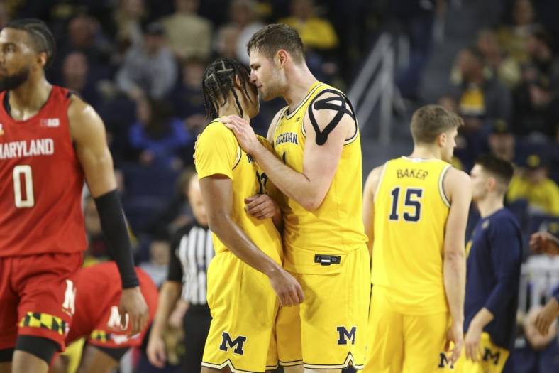 Jan 1, 2023; Ann Arbor, Michigan, USA; Michigan Wolverines center Hunter Dickinson (1) talks with guard Jett Howard (13) during the second half of the game against the Maryland Terrapins at Crisler Center. Mandatory Credit: Brian Bradshaw Sevald-USA TODAY Sports