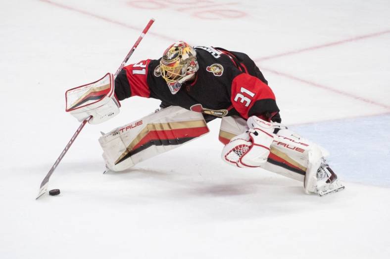 Jan 1,, 2023; Ottawa, Ontario, CAN; Ottawa Senators goalie Anton Forsberg (31) settles the puck in the third period against the Buffalo Sabres at the Canadian Tire Centre. Mandatory Credit: Marc DesRosiers-USA TODAY Sports
