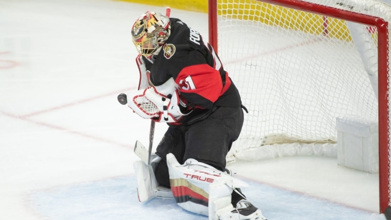 Jan 1,, 2023; Ottawa, Ontario, CAN; Ottawa Senators goalie Anton Forsberg (31) makes a save in the third period against the Buffalo Sabres at the Canadian Tire Centre. Mandatory Credit: Marc DesRosiers-USA TODAY Sports