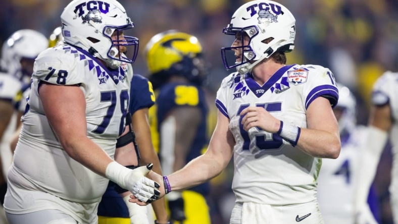 Dec 31, 2022; Glendale, Arizona, USA; TCU Horned Frogs offensive lineman Wes Harris (78) celebrates a touchdown with quarterback Max Duggan (15) against the Michigan Wolverines during the 2022 Fiesta Bowl at State Farm Stadium. Mandatory Credit: Mark J. Rebilas-USA TODAY Sports