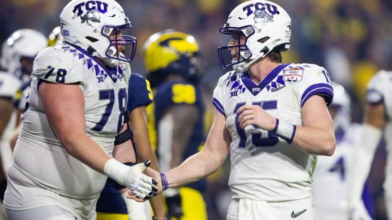 Dec 31, 2022; Glendale, Arizona, USA; TCU Horned Frogs offensive lineman Wes Harris (78) celebrates a touchdown with quarterback Max Duggan (15) against the Michigan Wolverines during the 2022 Fiesta Bowl at State Farm Stadium. Mandatory Credit: Mark J. Rebilas-USA TODAY Sports