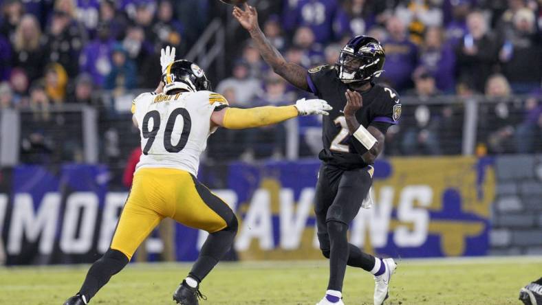 Jan 1, 2023; Baltimore, Maryland, USA; Baltimore Ravens quarterback Tyler Huntley (2) throws a pass against Pittsburgh Steelers linebacker T.J. Watt (90) during the second half at M&T Bank Stadium. Mandatory Credit: Jessica Rapfogel-USA TODAY Sports