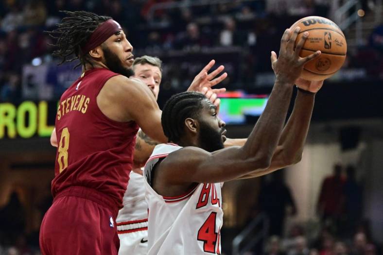 Jan 2, 2023; Cleveland, Ohio, USA; Chicago Bulls forward Patrick Williams (44) grabs a rebound ahead of Cleveland Cavaliers forward Lamar Stevens (8) during the first half at Rocket Mortgage FieldHouse. Mandatory Credit: Ken Blaze-USA TODAY Sports